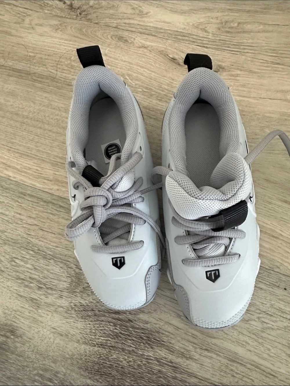 Nike Light Gray and White Cleats with Black Swoosh